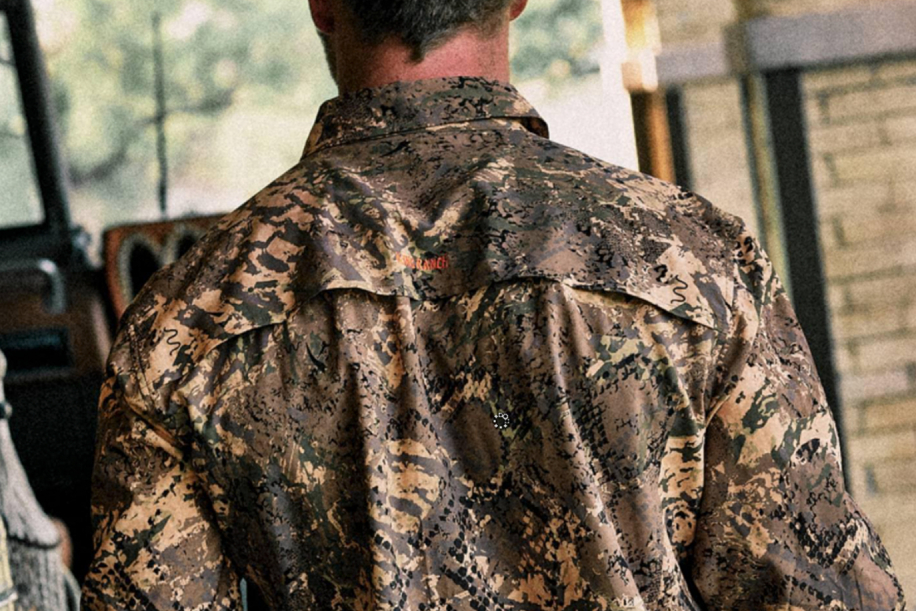 rear view of man in camo shirt